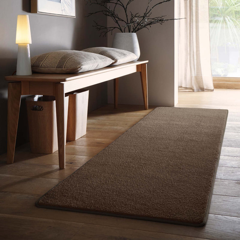 Sense Stone Washable Runner in Brown, styled on wooden flooring.