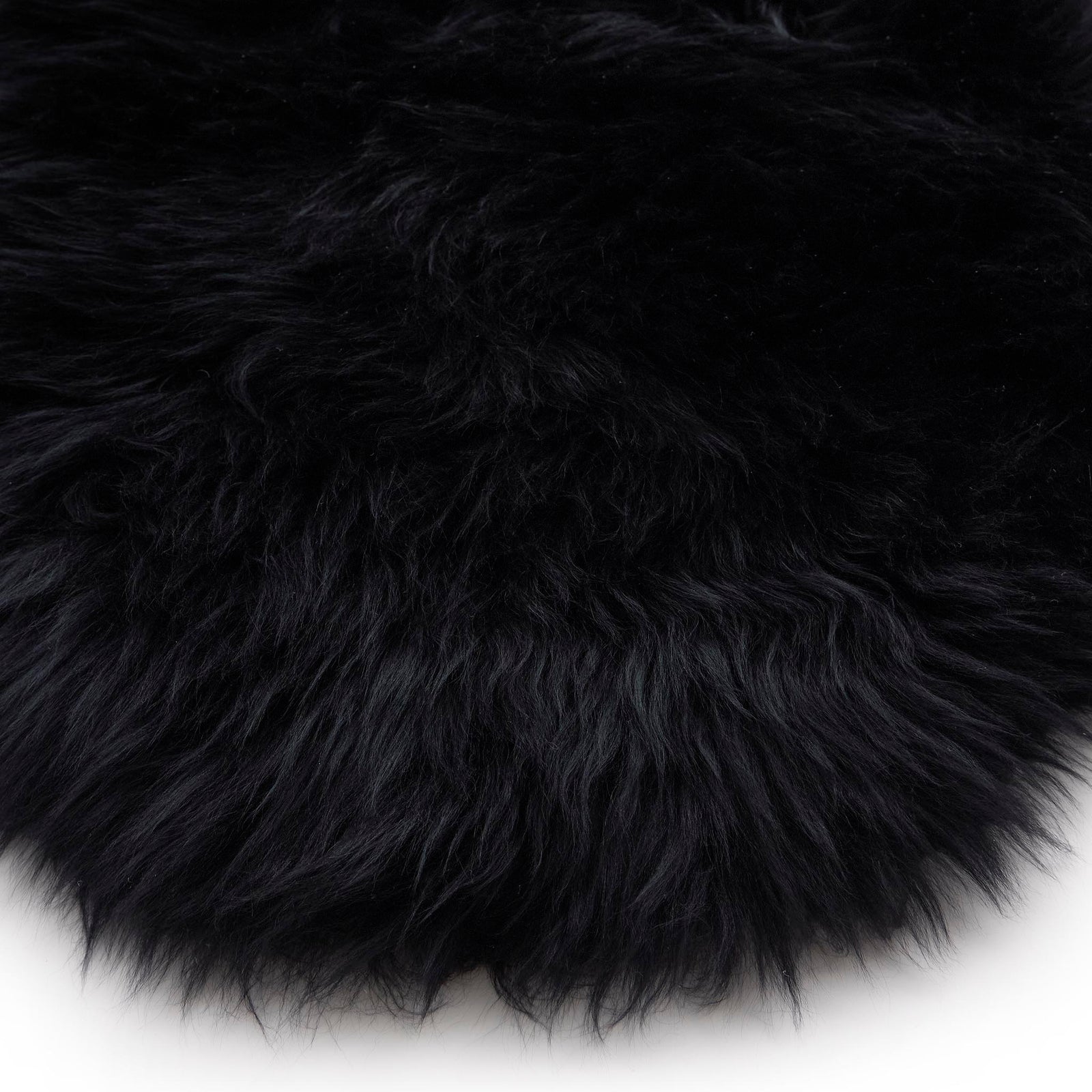 Close-up of Double Sheepskin Black Rug made up of long-haired wool.