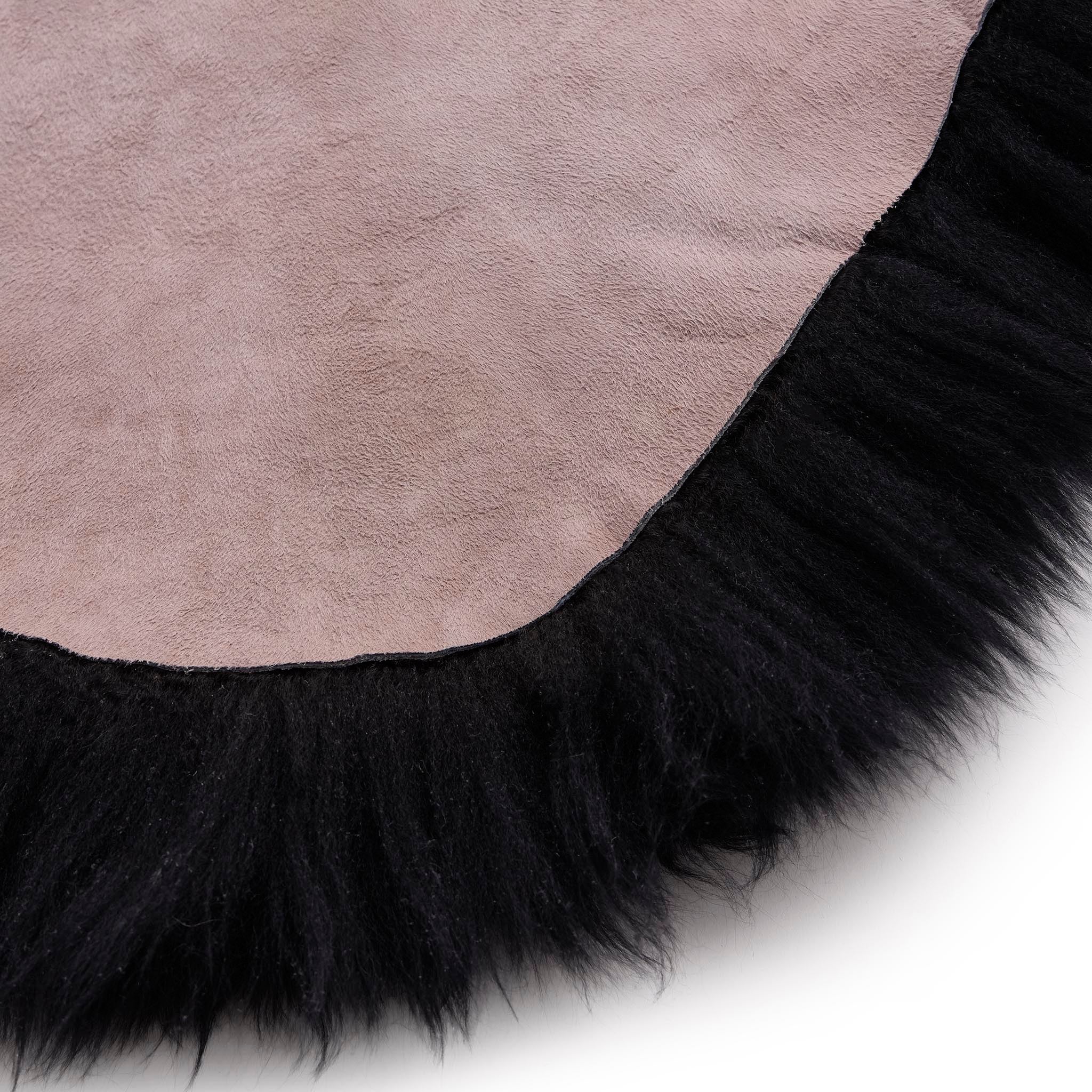Close-up of Double Sheepskin Black Rug made up of long-haired wool.