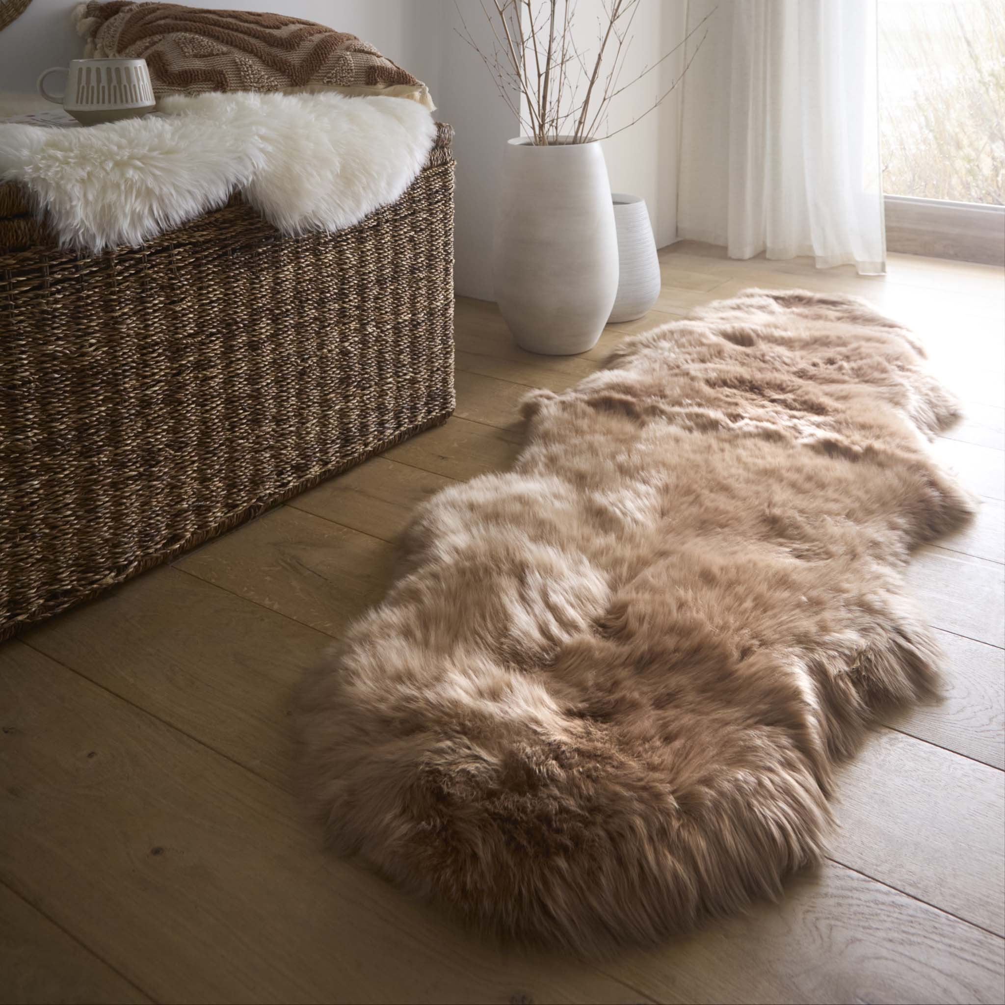 Double Sheepskin Mink Brown Wool Rug made from long-haired wool, styled on wooden flooring. 