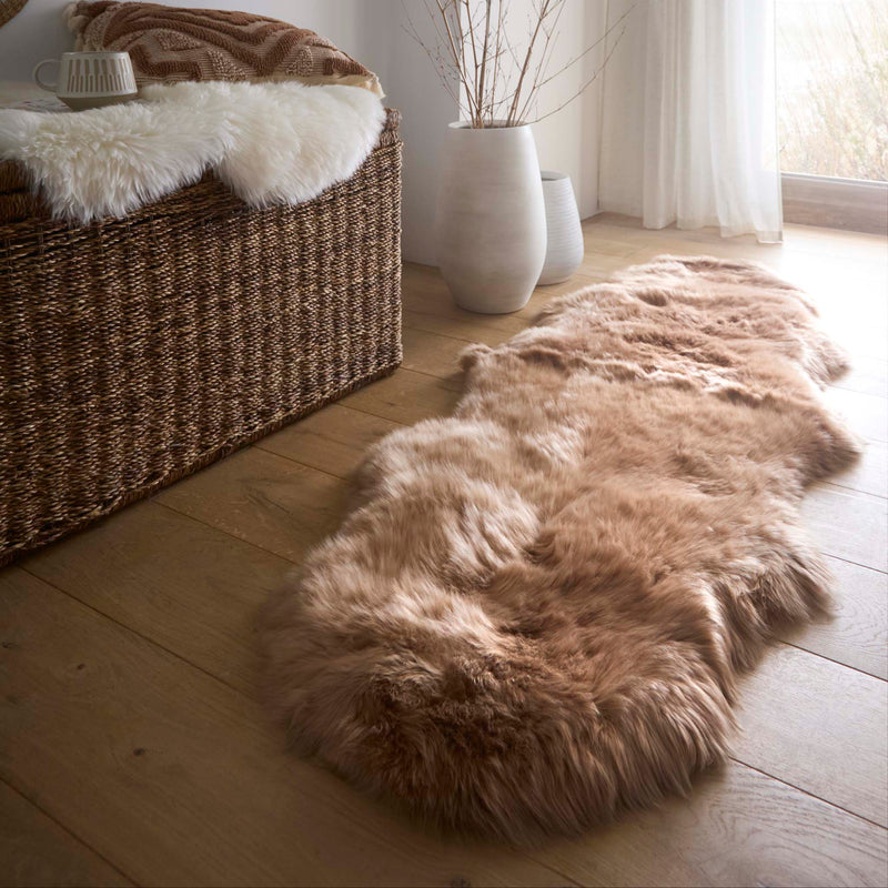 Double Sheepskin Mink Brown Wool Rug made from long-haired wool, styled on wooden flooring. 