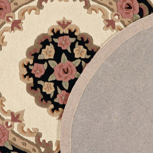 Close-up of Shensi Black Wool Rug with a tradtional floral pattern.