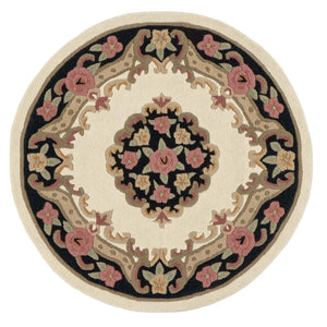 Shensi Black Wool Circle Rug with a tradtional floral pattern.
