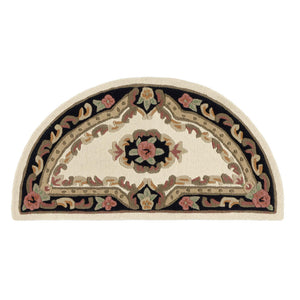 Close-up of Shensi Black Half Moon Rug with a tradtional floral pattern.