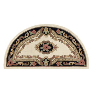 Close-up of Shensi Black Half Moon Rug with a tradtional floral pattern.