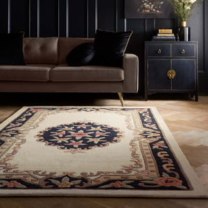 Shensi Black Wool Rug with a tradtional floral pattern, styled in a living room.