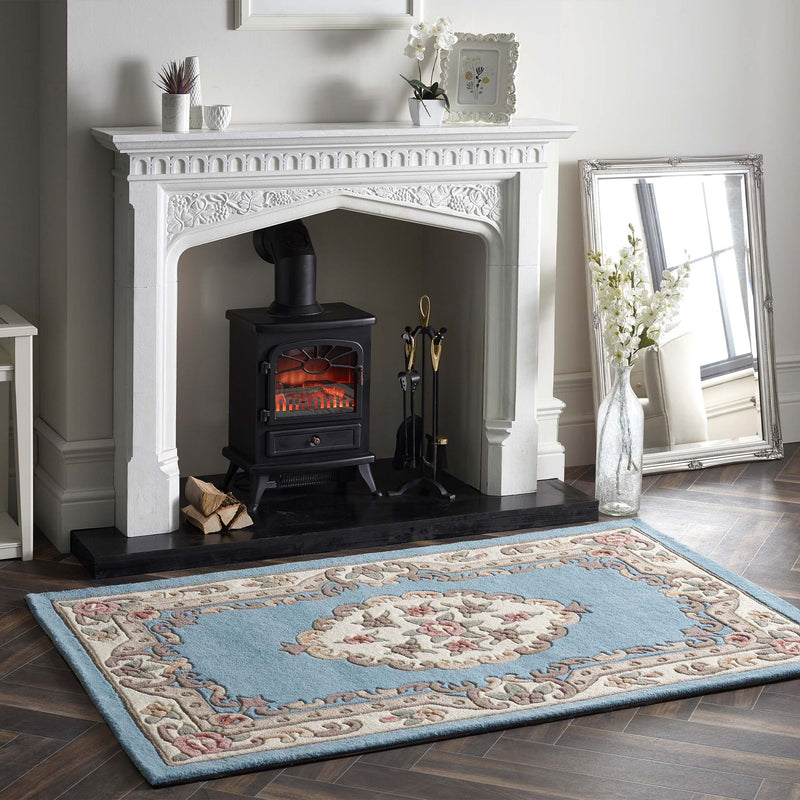 Shensi Blue Rug - a 100% wool rug featuring a traditional floral pattern.