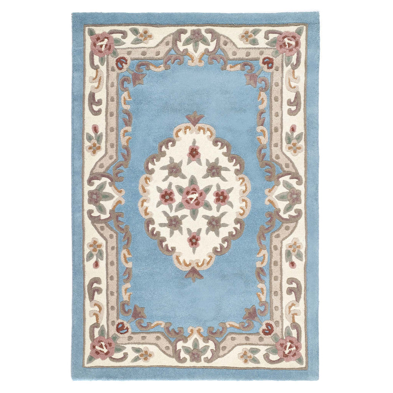 Shensi Blue Rug - a 100% wool rug featuring a traditional floral pattern.