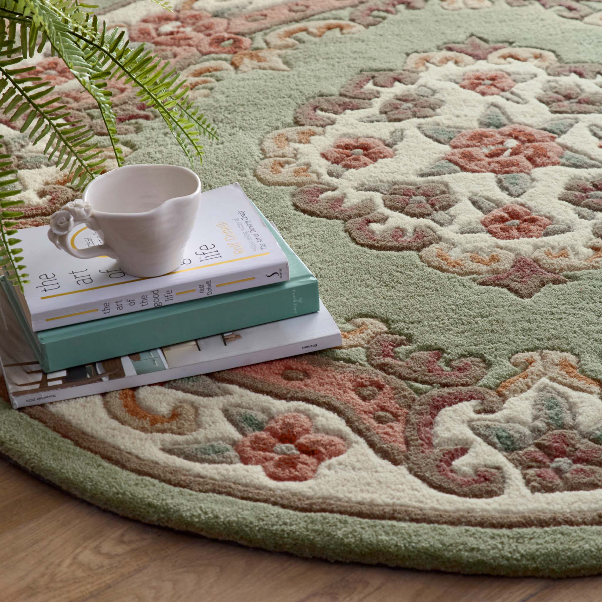 Shensi Green Rug - a 100% wool rug featuring a traditional floral pattern.