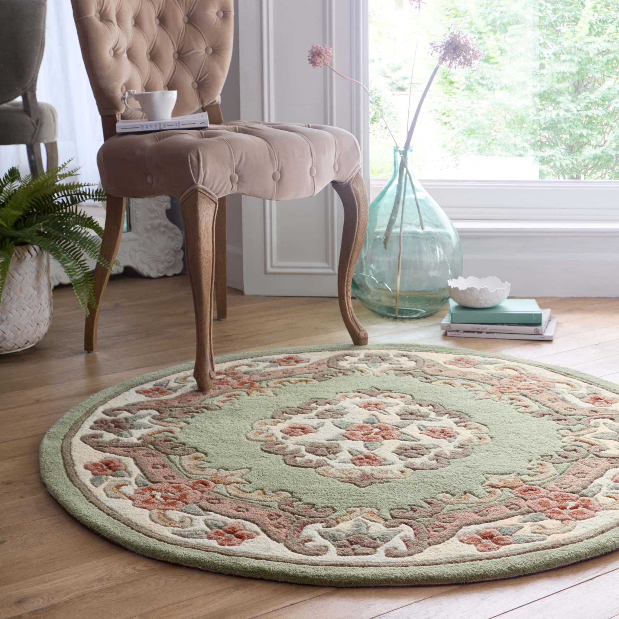 Shensi Green Rug - a 100% wool rug featuring a traditional floral pattern.