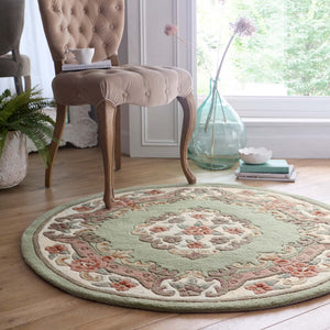 Shensi Green Rug - a 100% wool rug featuring a traditional floral pattern.