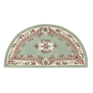 Shensi Green Rug - a 100% wool rug featuring a traditional floral pattern.
