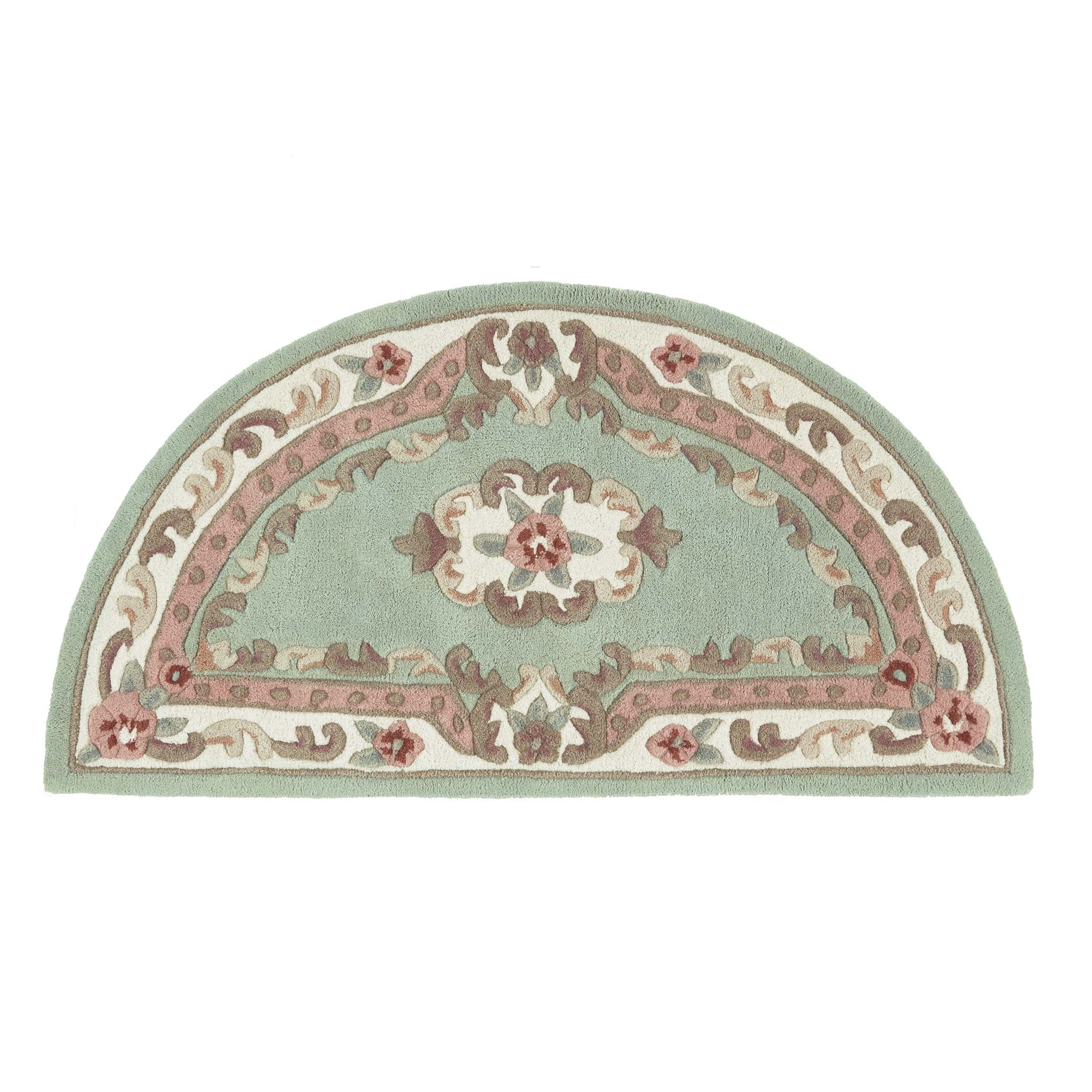 Shensi Green Rug - a 100% wool rug featuring a traditional floral pattern.