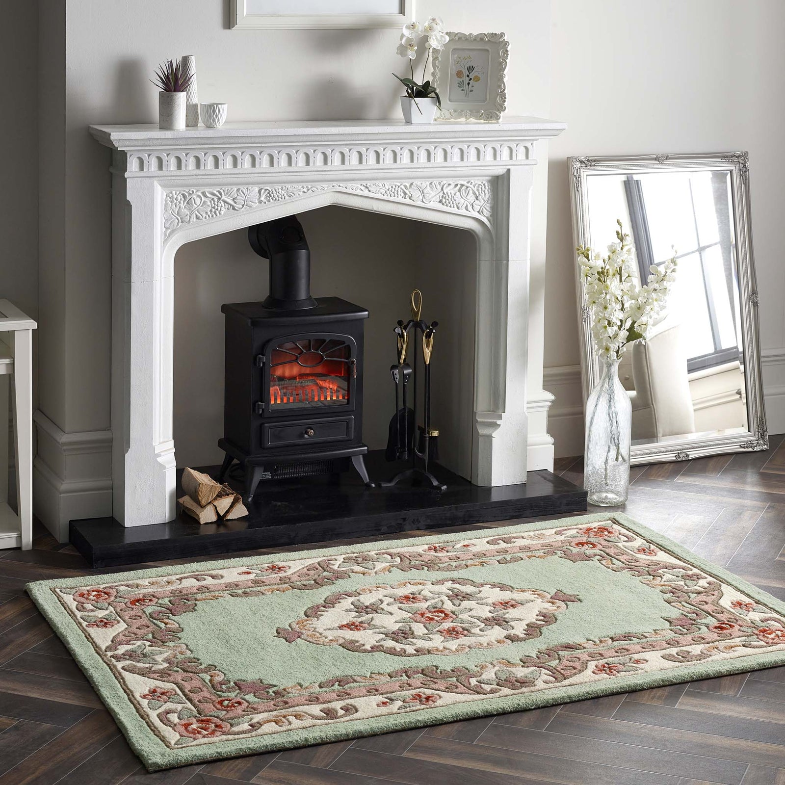 Shensi Green Rug - a 100% wool rug featuring a traditional floral pattern.