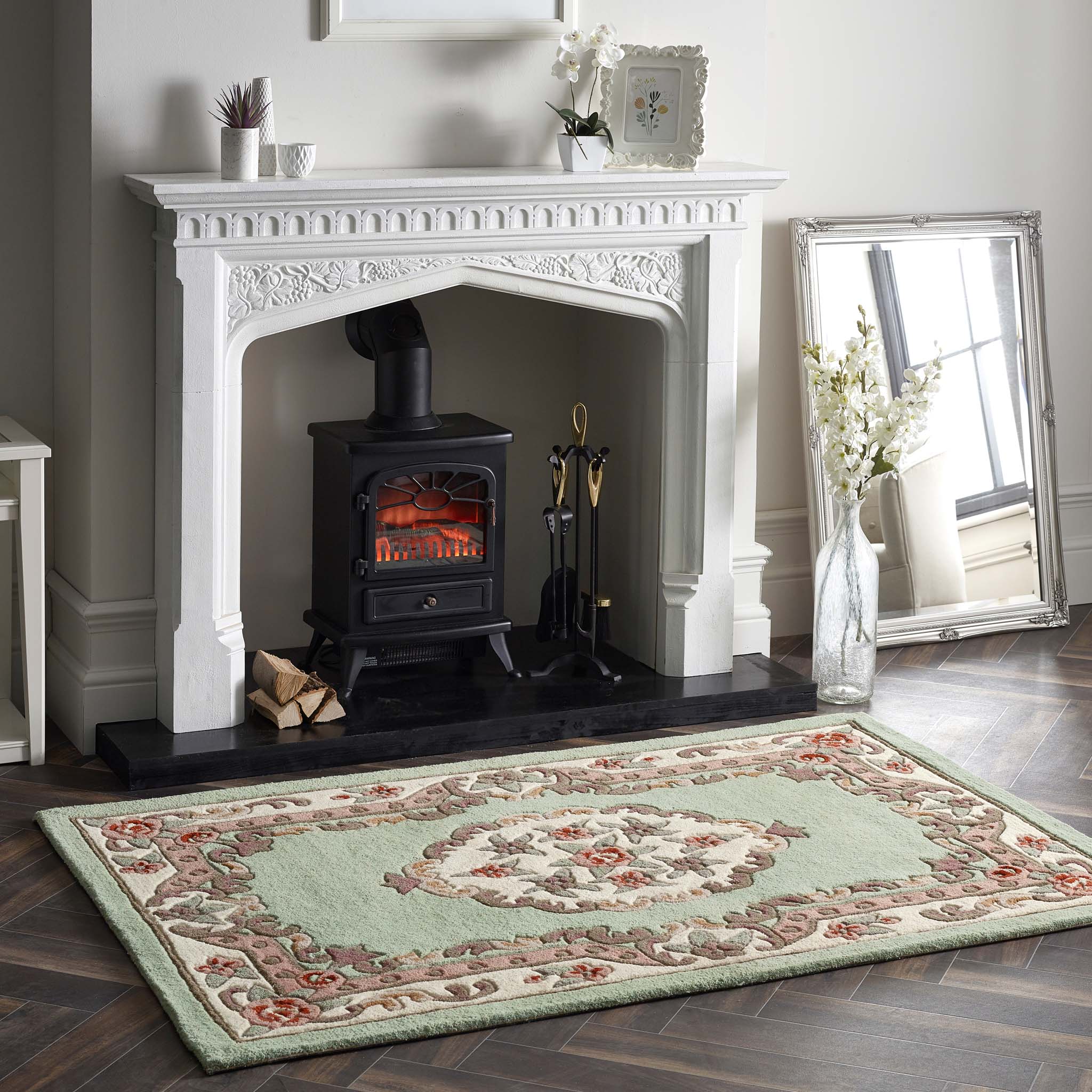 Shensi Green Rug - a 100% wool rug featuring a traditional floral pattern.