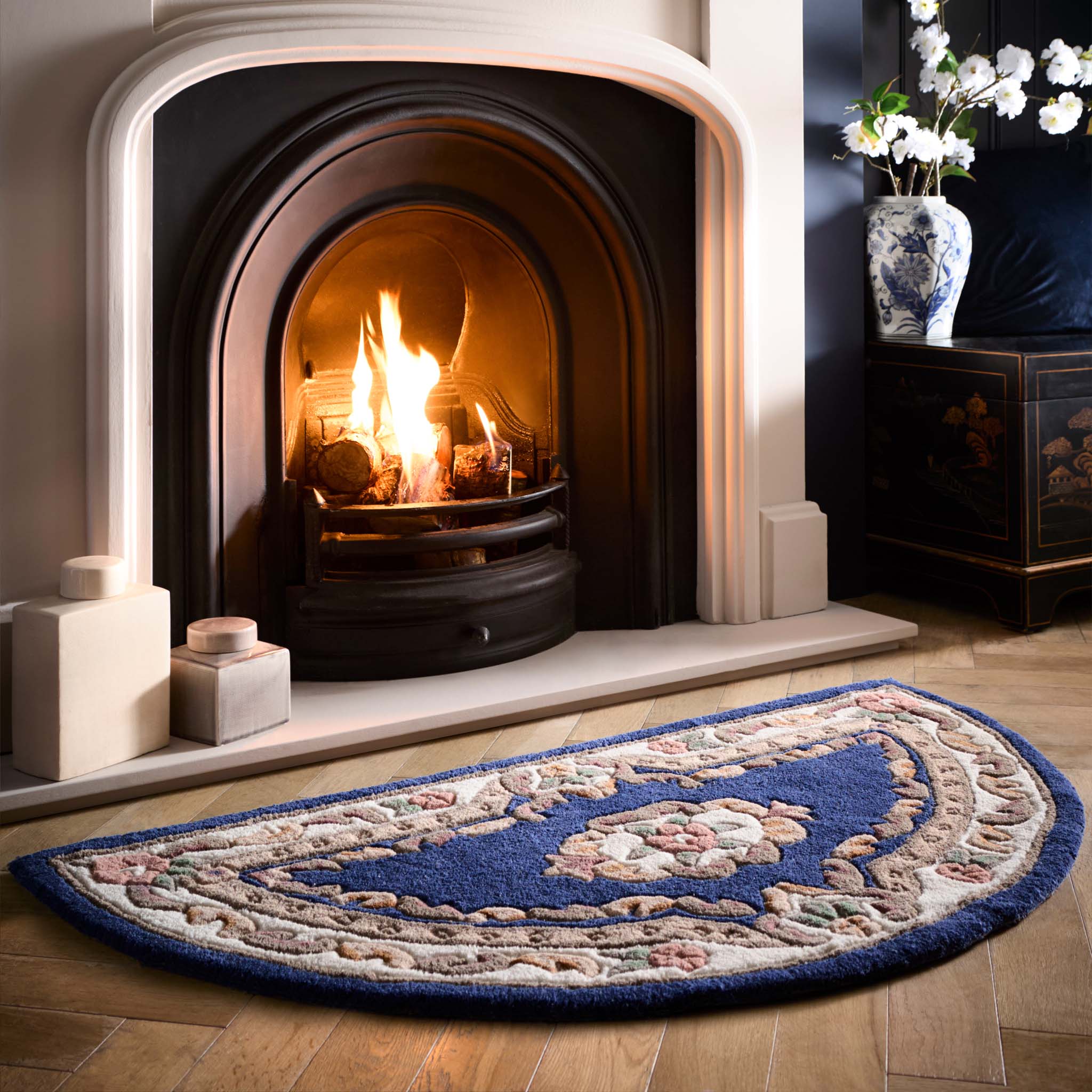 Shensi Navy Blue Wool Rug with a traditional floral pattern, styled in living room. 