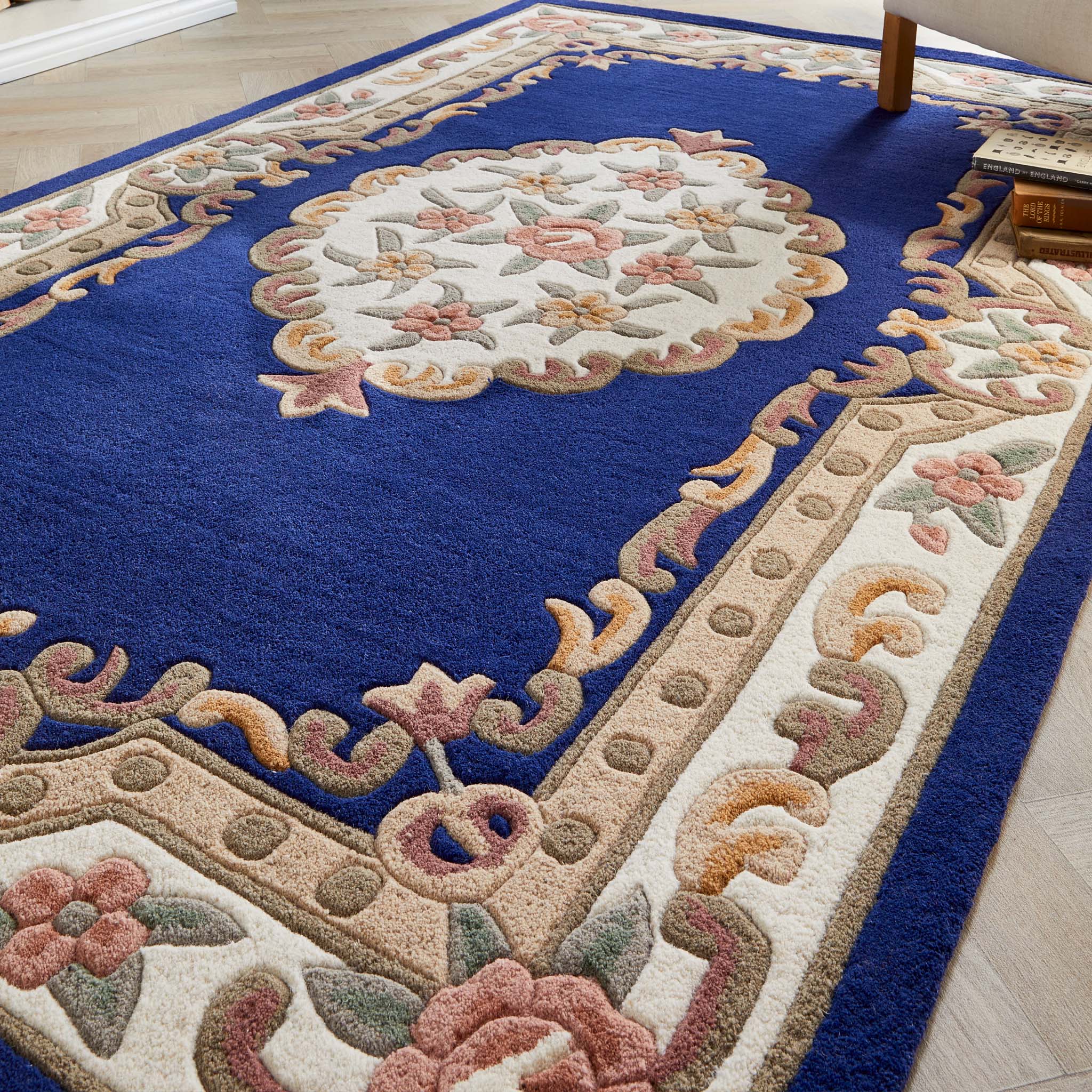 Shensi Navy Blue Wool Rug with a traditional floral pattern, styled on wooden flooring.