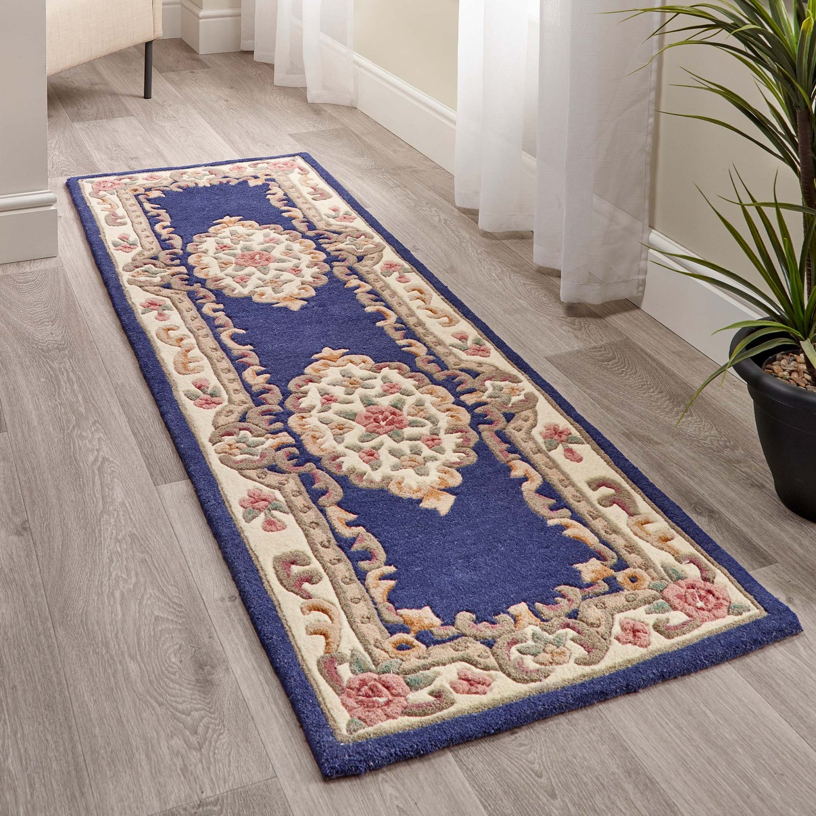 Shensi Navy Blue Wool Runner with a traditional floral pattern, styled in a hallway.