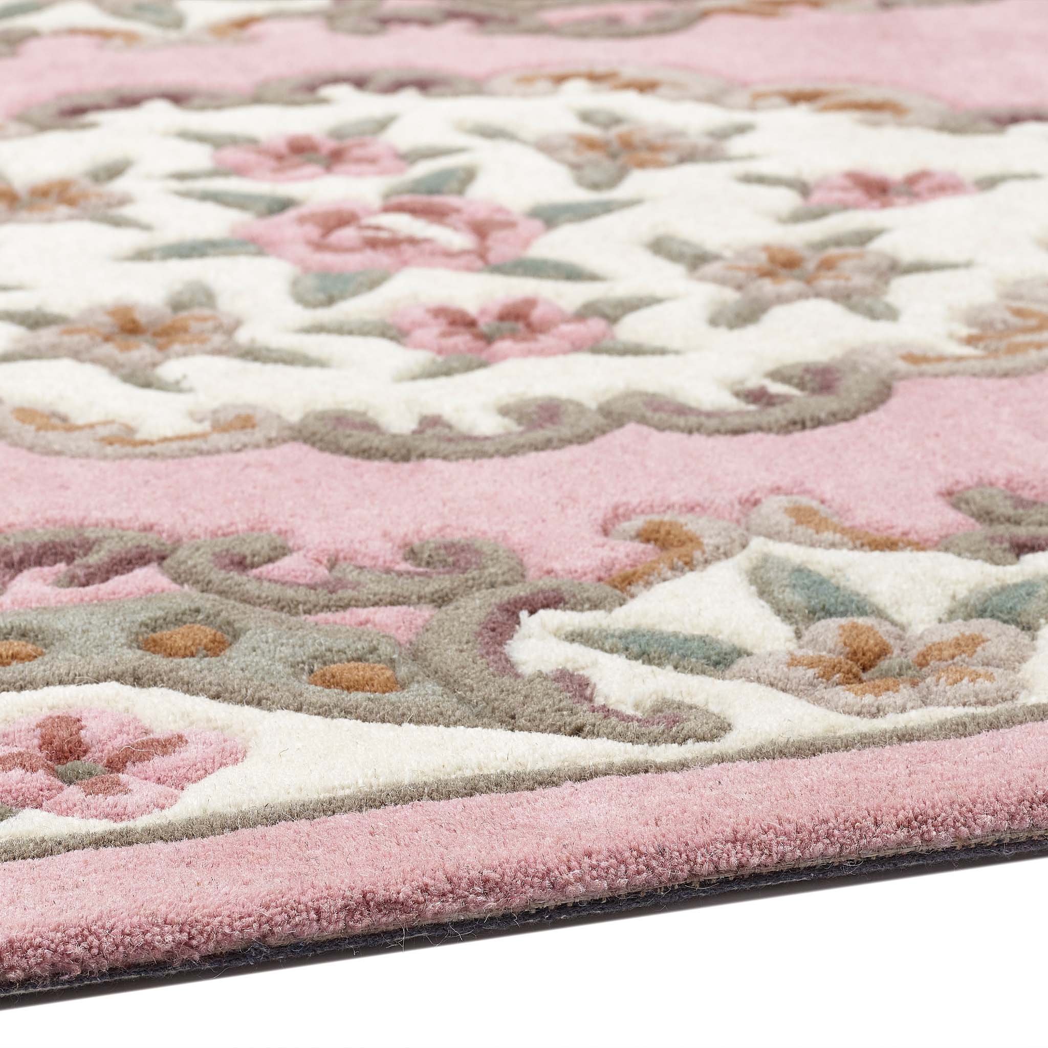 Shensi Pink Wool Rug with a traditional floral pattern, styled on wooden flooring.