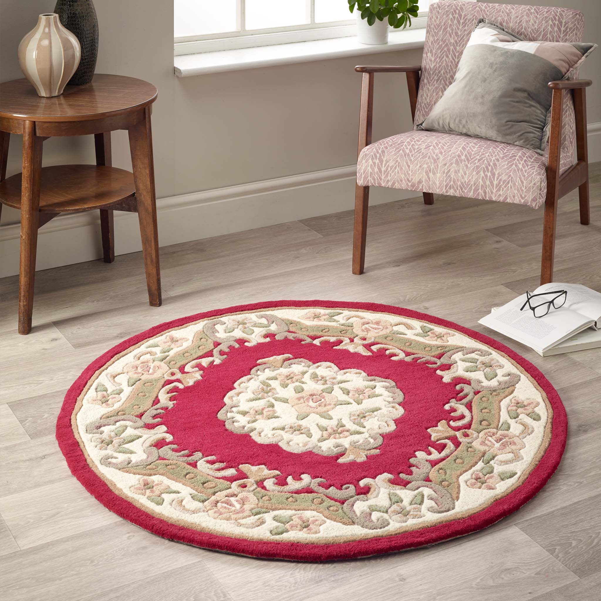 Shensi Wine Red Wool Rug with a traditional floral pattern, styled on wooden flooring.