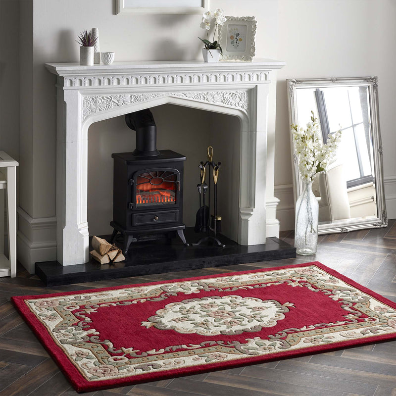 Shensi Wine Red Wool Rug with a traditional floral pattern, styled in living room.