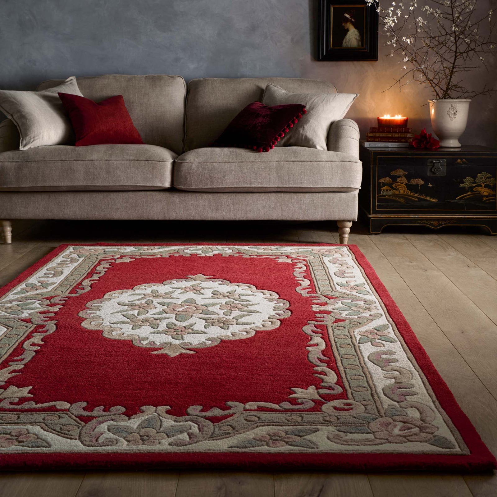 Shensi Wine Red Wool Rug with a traditional floral pattern, styled in living room.