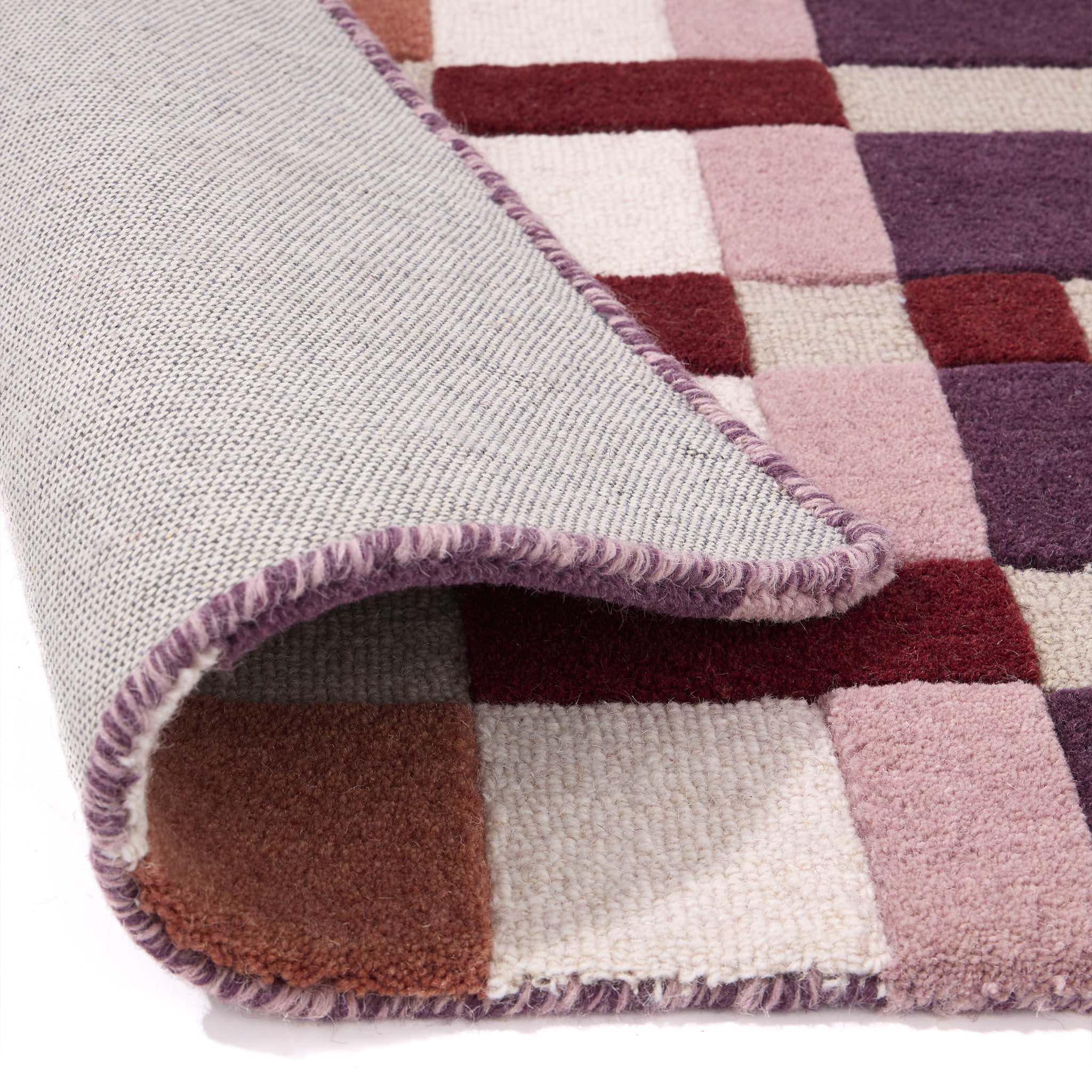 Discover the Sienna Weave Rug- 100% handwoven wool rug in pink, cream and purple. 