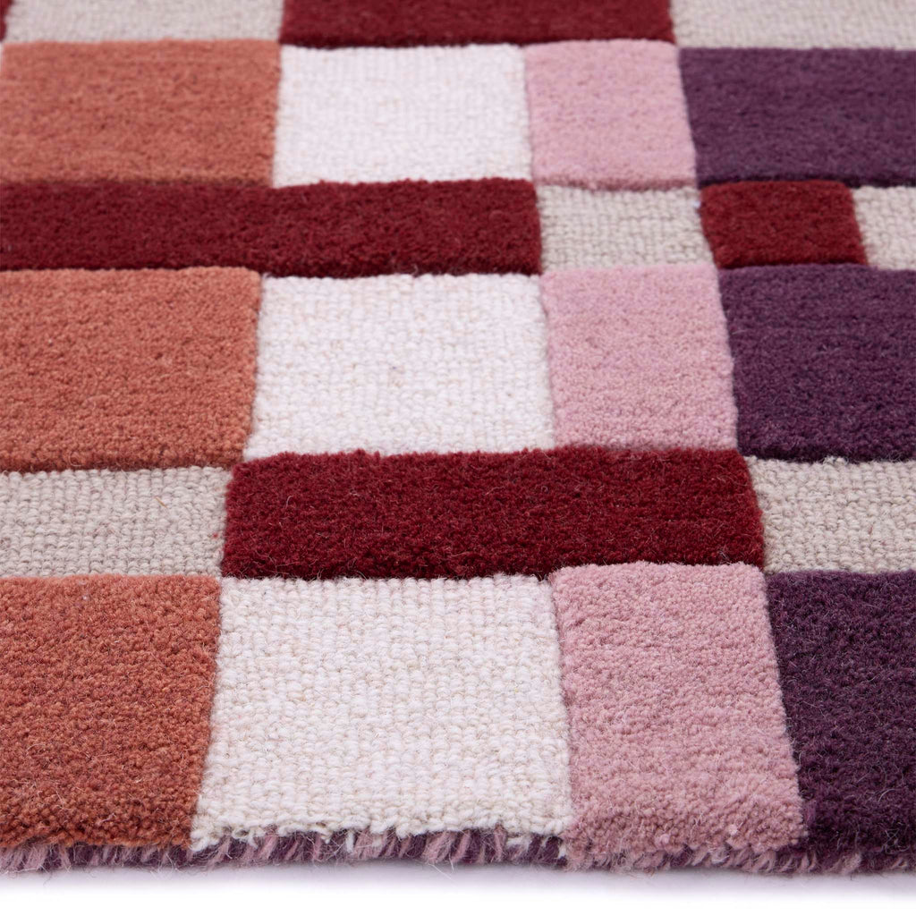 Discover the Sienna Weave Rug- 100% handwoven wool rug in pink, cream and purple. 