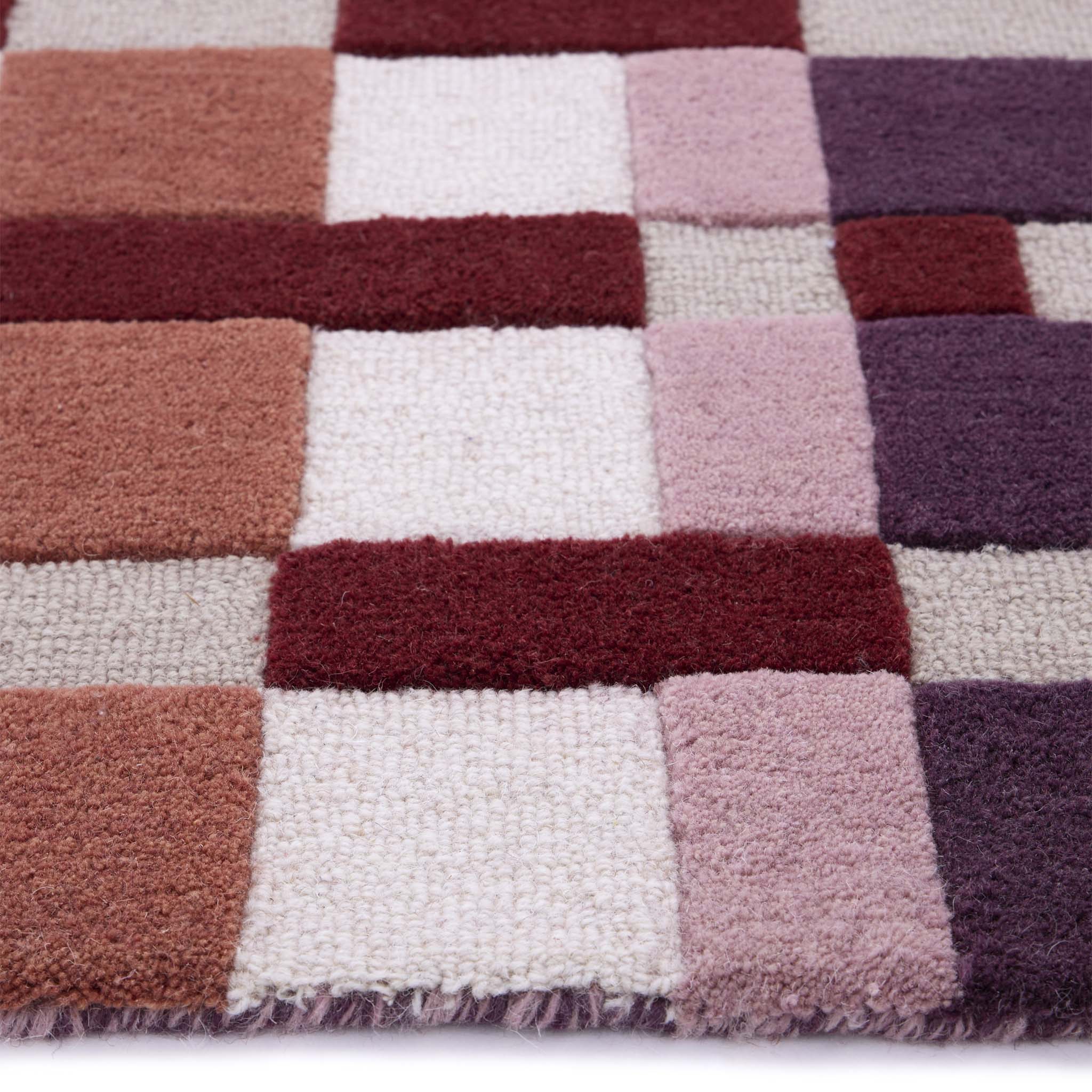 Discover the Sienna Weave Rug- 100% handwoven wool rug in pink, cream and purple. 