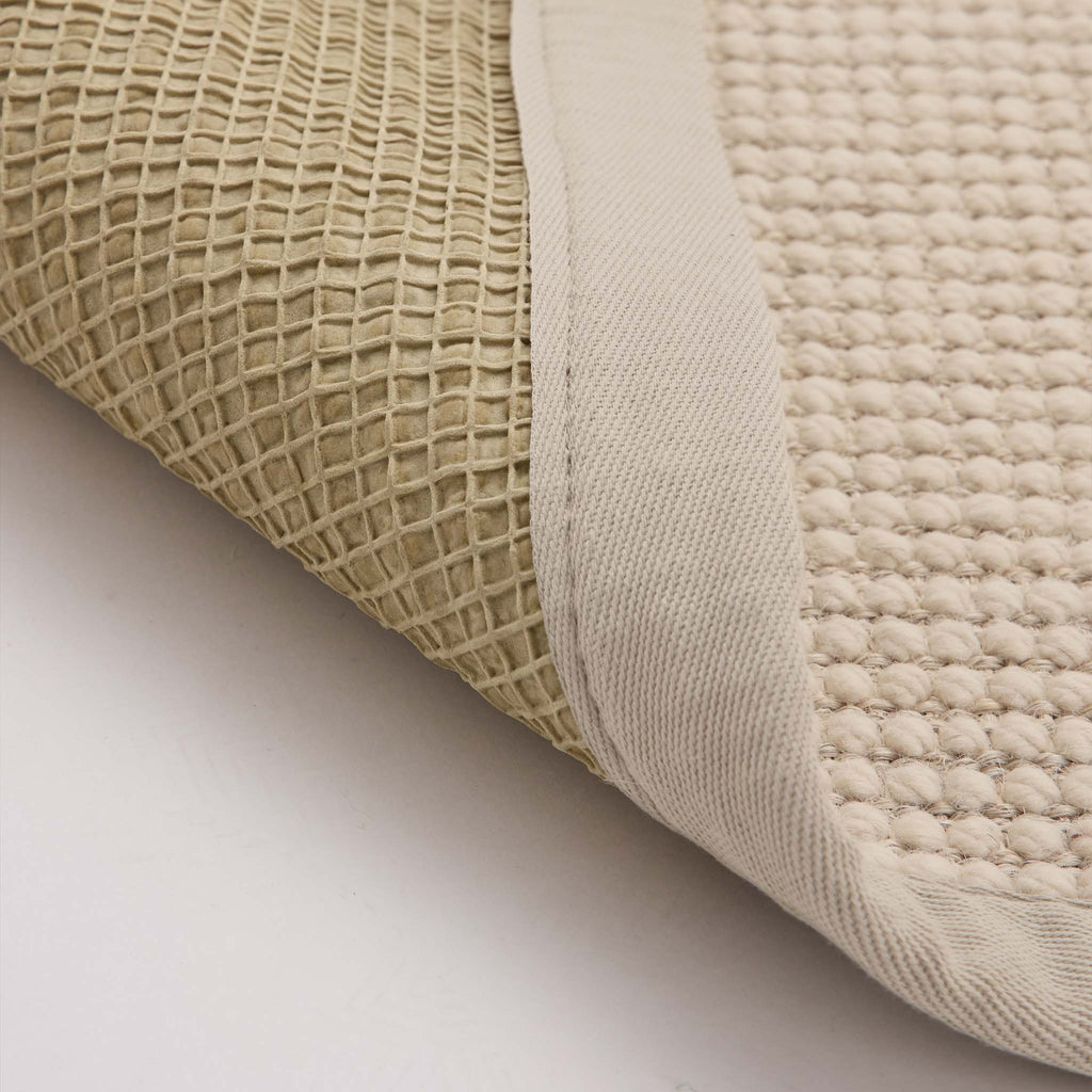 Sisal Boucle Beige Rug- a jute wool blend rug with a beige border. 