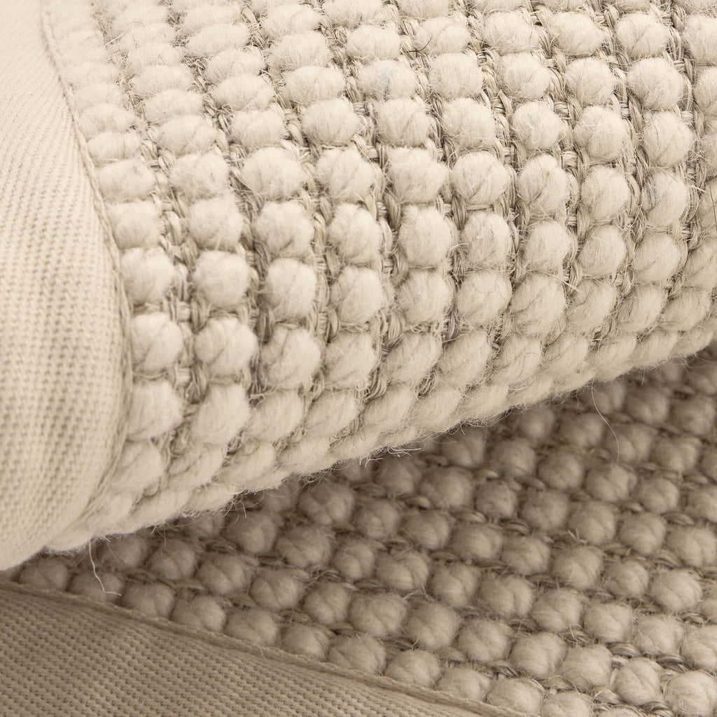 Sisal Boucle Beige Rug- a jute wool blend rug with a beige border. 