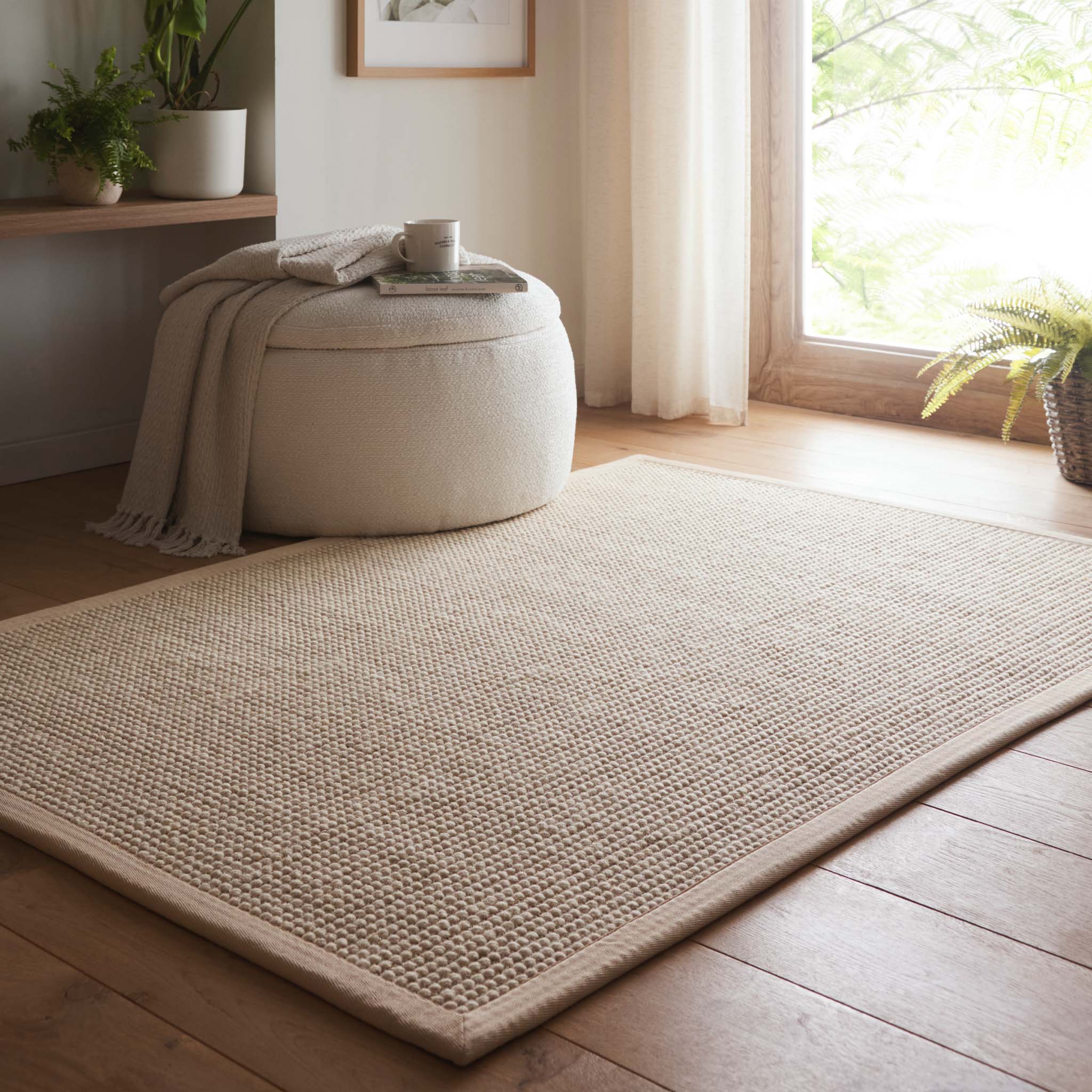 Sisal Boucle Beige Rug- a jute wool blend rug with a beige border. 