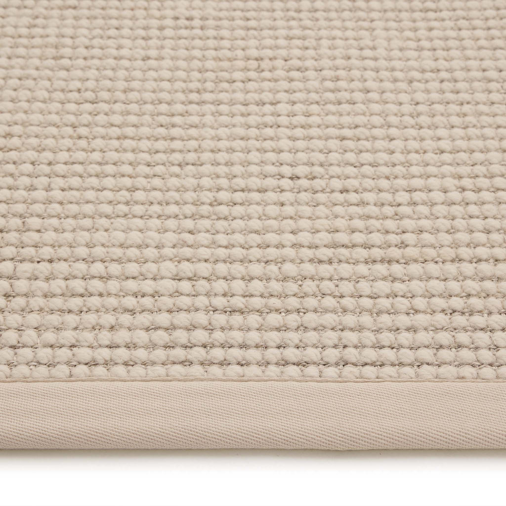 Sisal Boucle Beige Rug- a jute wool blend rug with a beige border. 