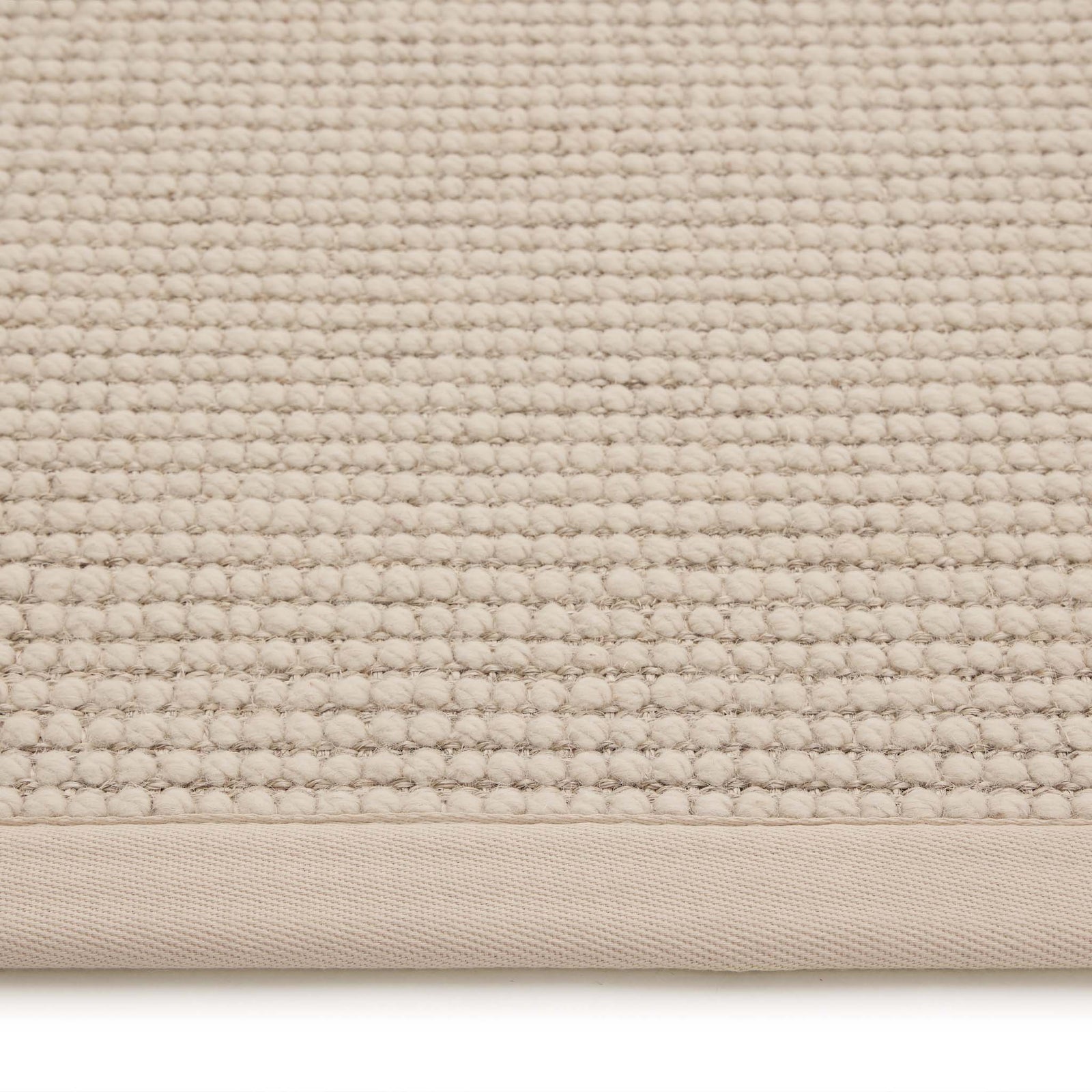 Sisal Boucle Beige Rug made from 100% wool with a beige border.