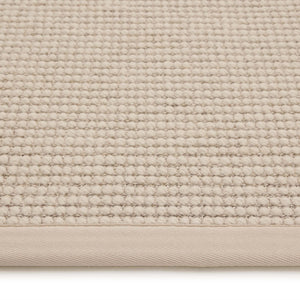 Sisal Boucle Beige Rug- a jute wool blend rug with a beige border. 