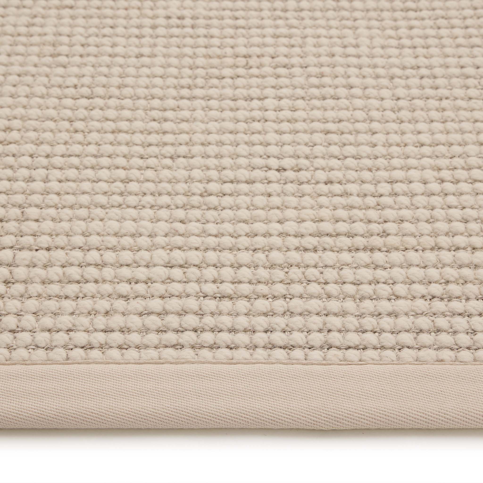 Sisal Boucle Beige Rug made from 100% wool with a beige border.