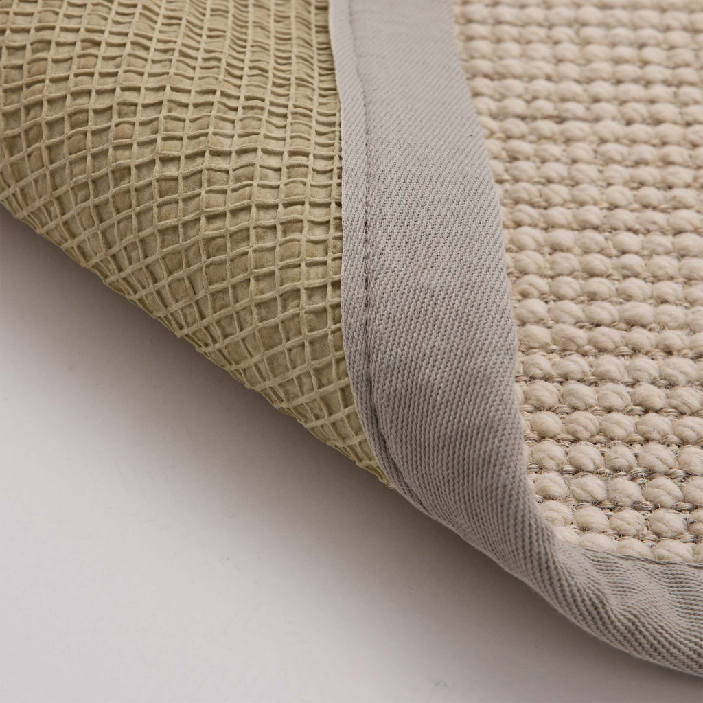 Sisal Boucle Grey Rug- a jute wool blend rug with a grey border. 