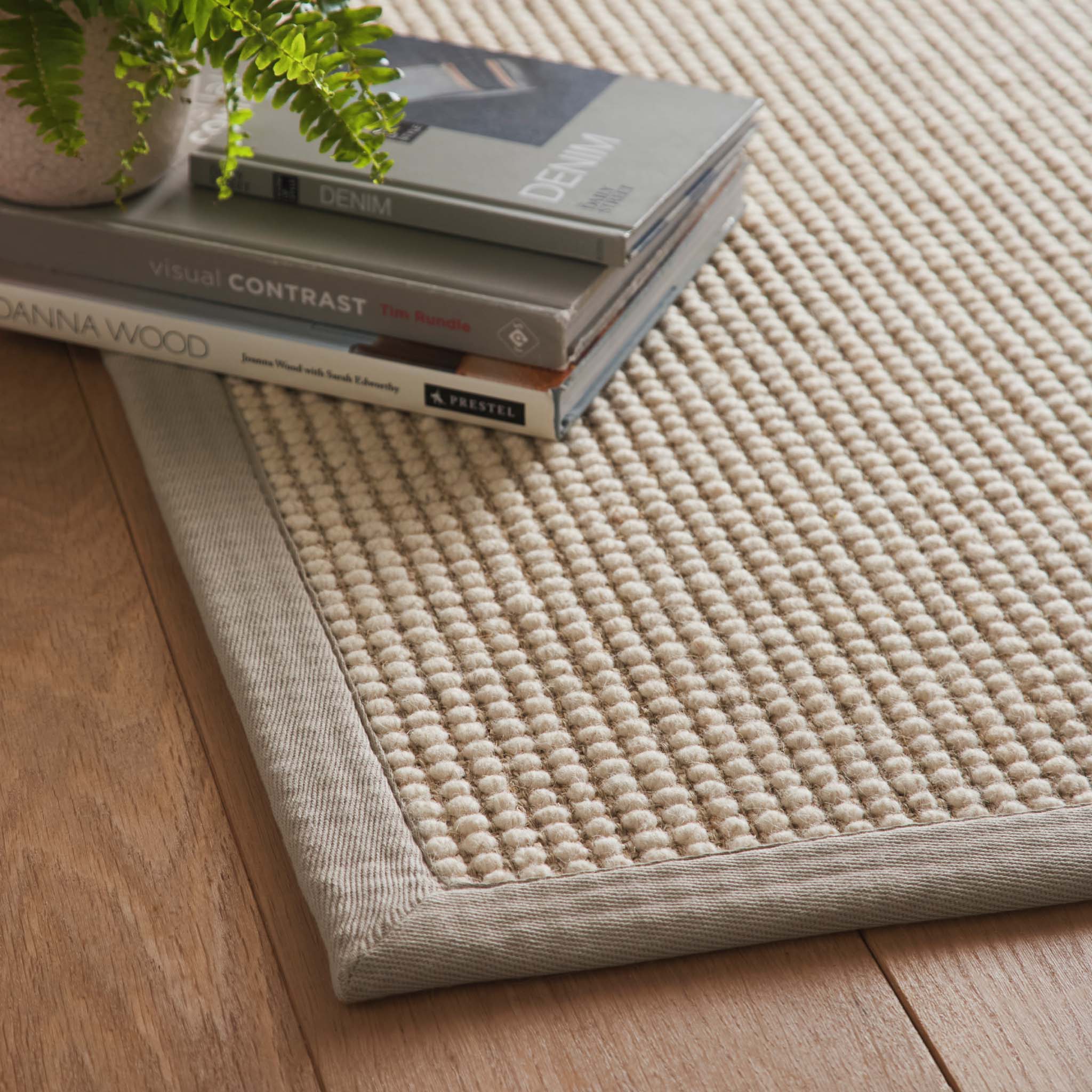 Sisal Boucle Grey Rug made from 100% wool with a solid grey border. 