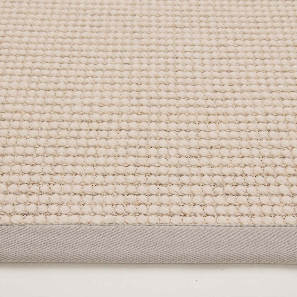 Sisal Boucle Grey Rug- a jute wool blend rug with a grey border. 