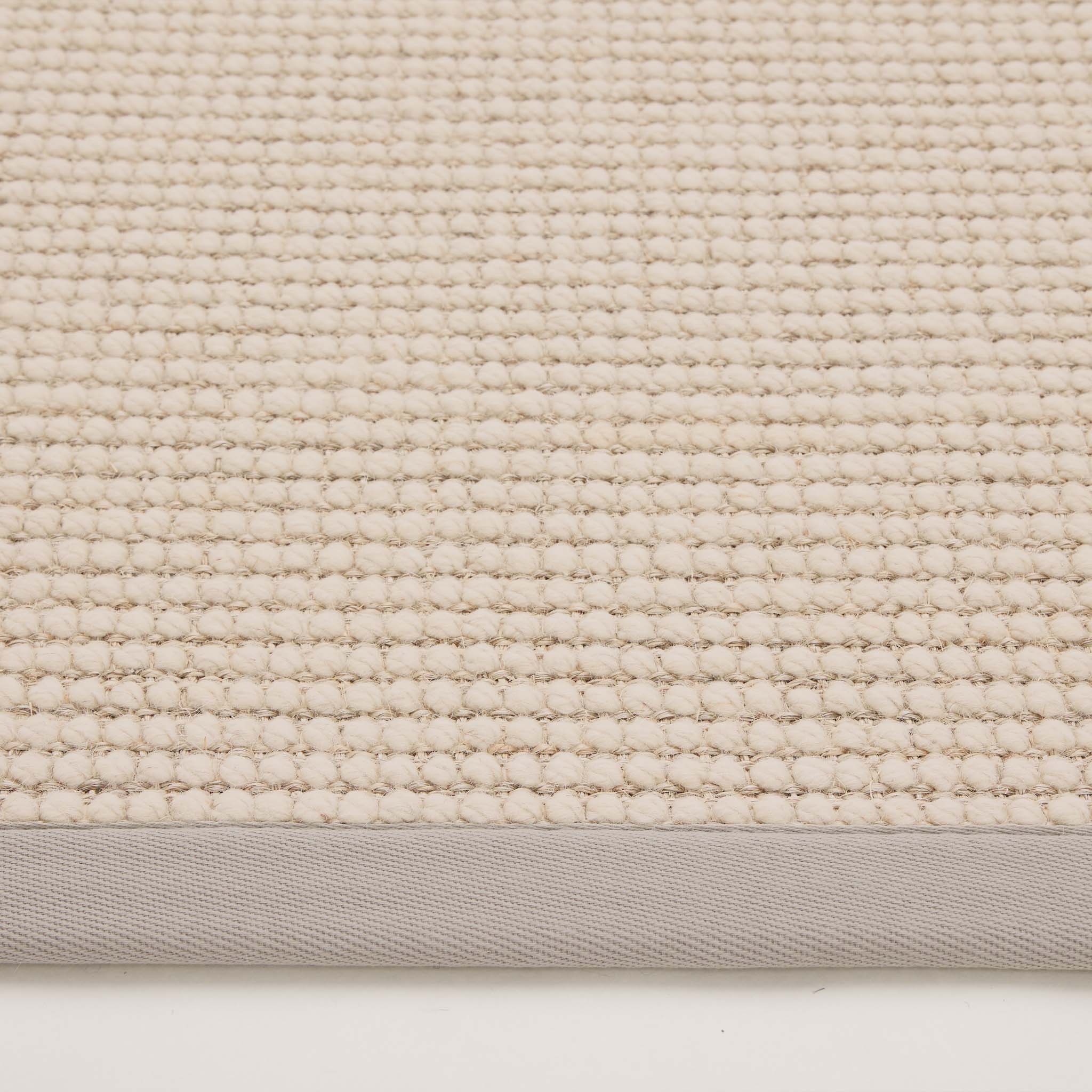 Sisal Boucle Grey Rug made from 100% wool with a solid grey border. 