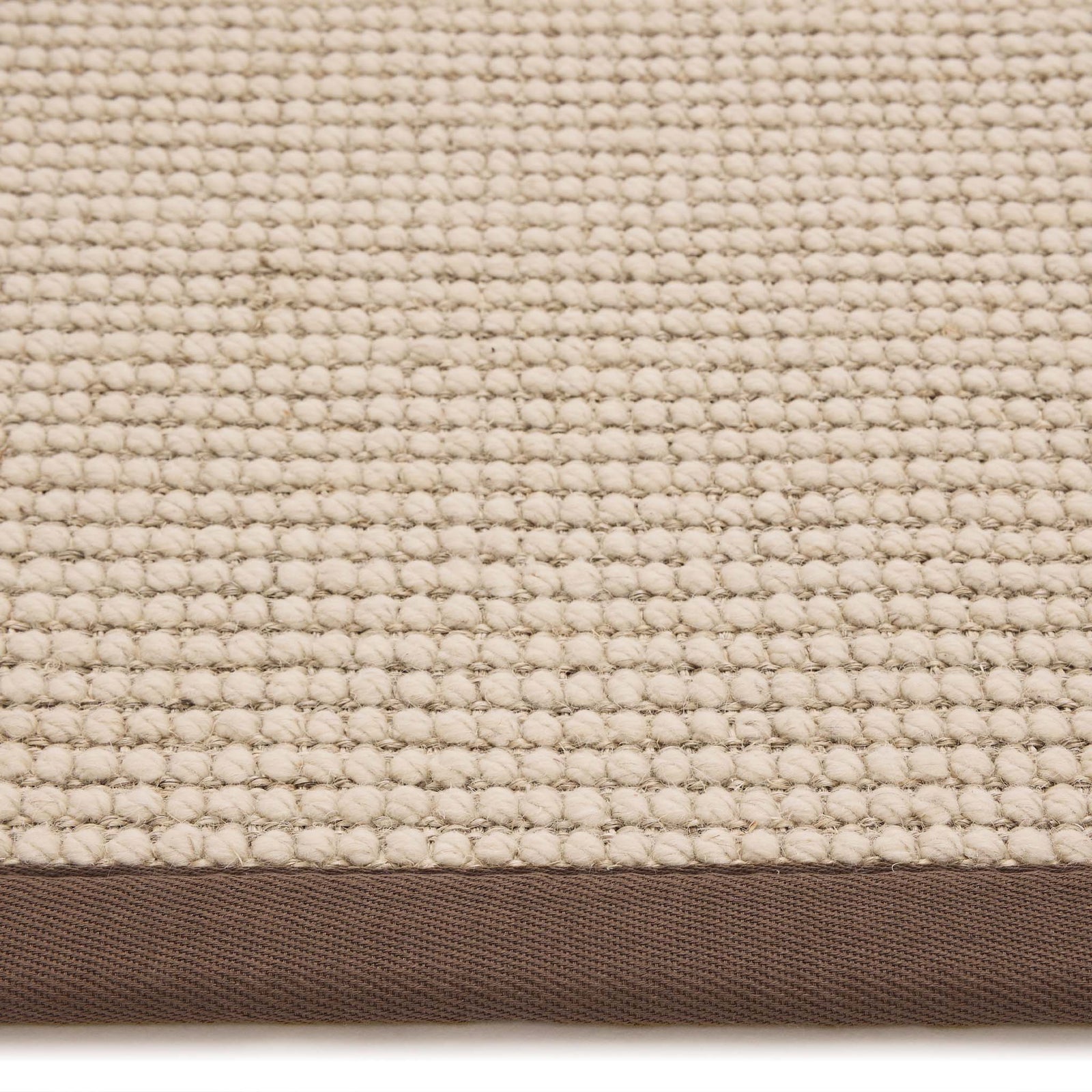 Sisal Boucle Mocha Rug made from 100% wool with a solid brown border. 