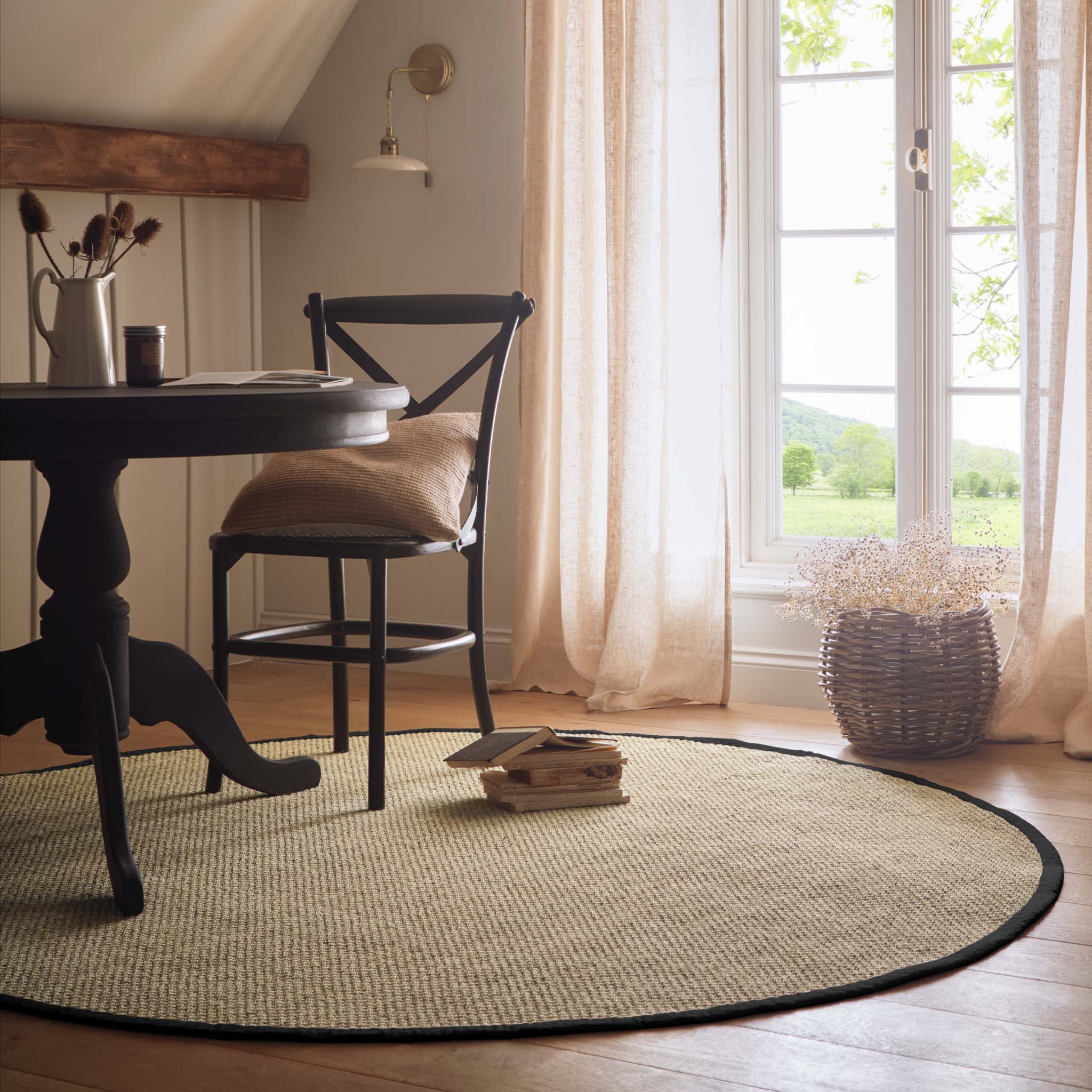 Sisal Rug- 100% Sisal circle rug with a black border. 