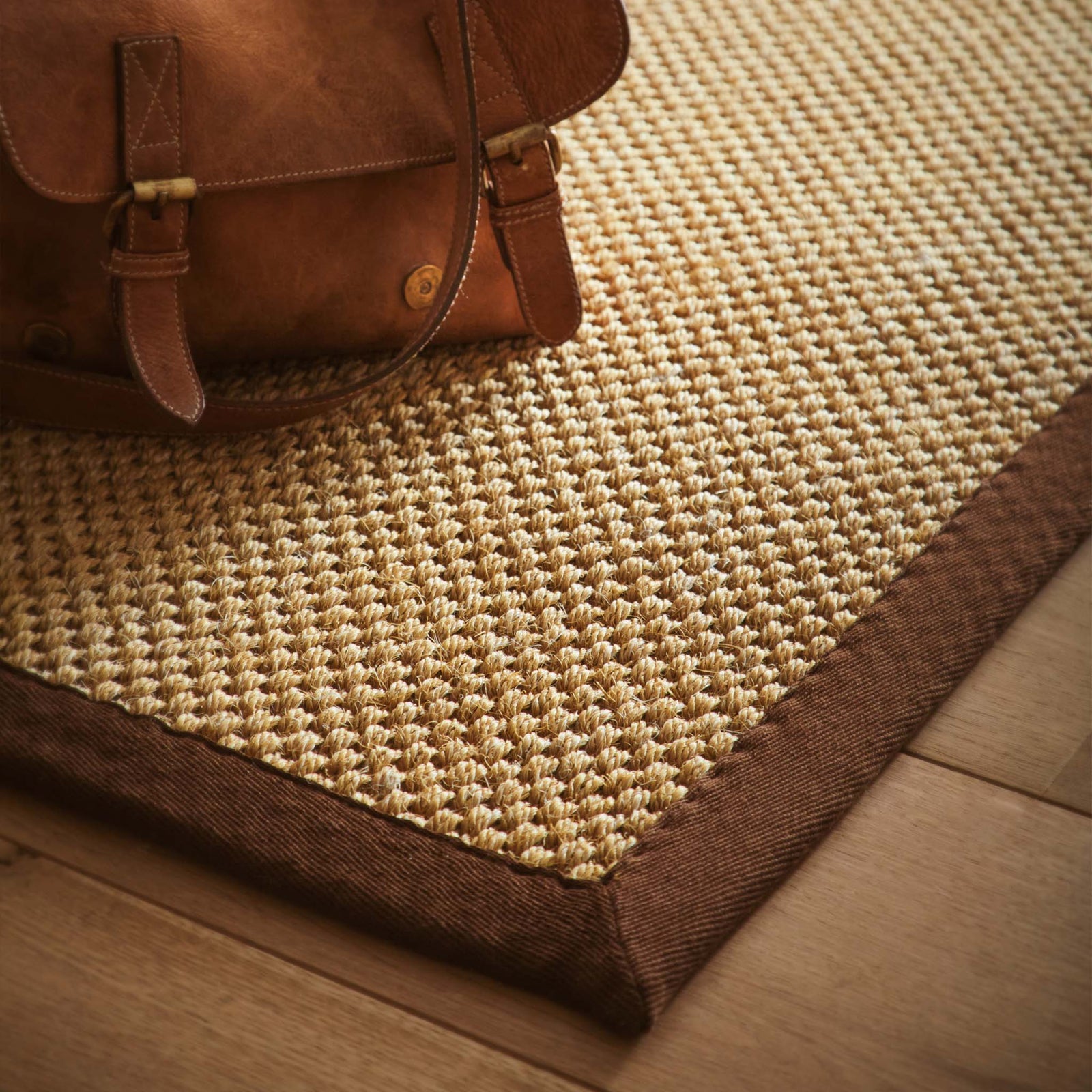 Sisal Warm Natural with Dark Brown Border Runner with a two toned border design, styled on wooden flooring.
