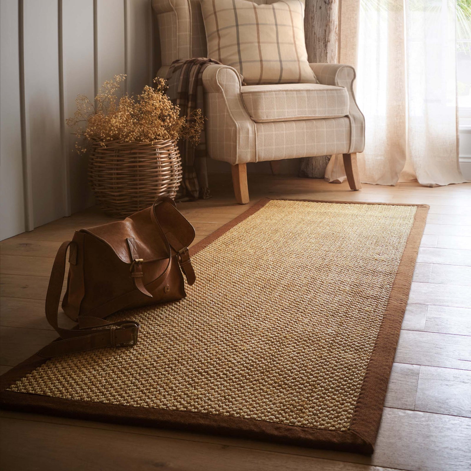 Sisal Warm Natural with Dark Brown Border Runner with a two toned border design, styled on wooden flooring.