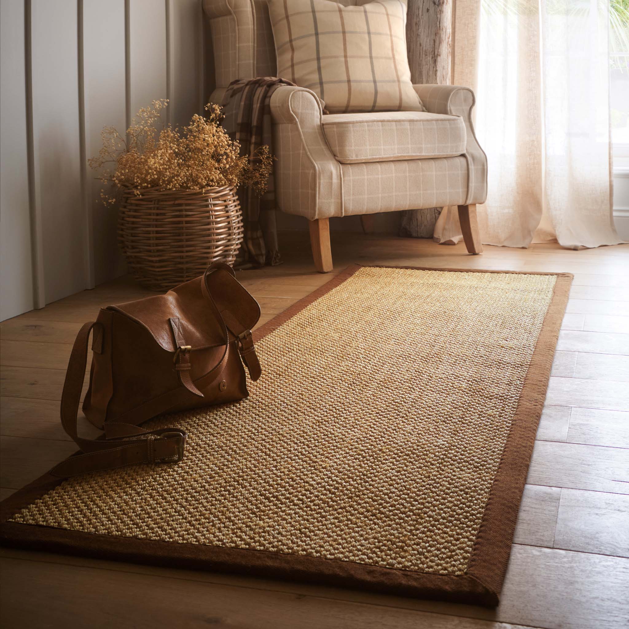 Sisal Warm Natural with Dark Brown Border Runner with a two toned border design, styled on wooden flooring.