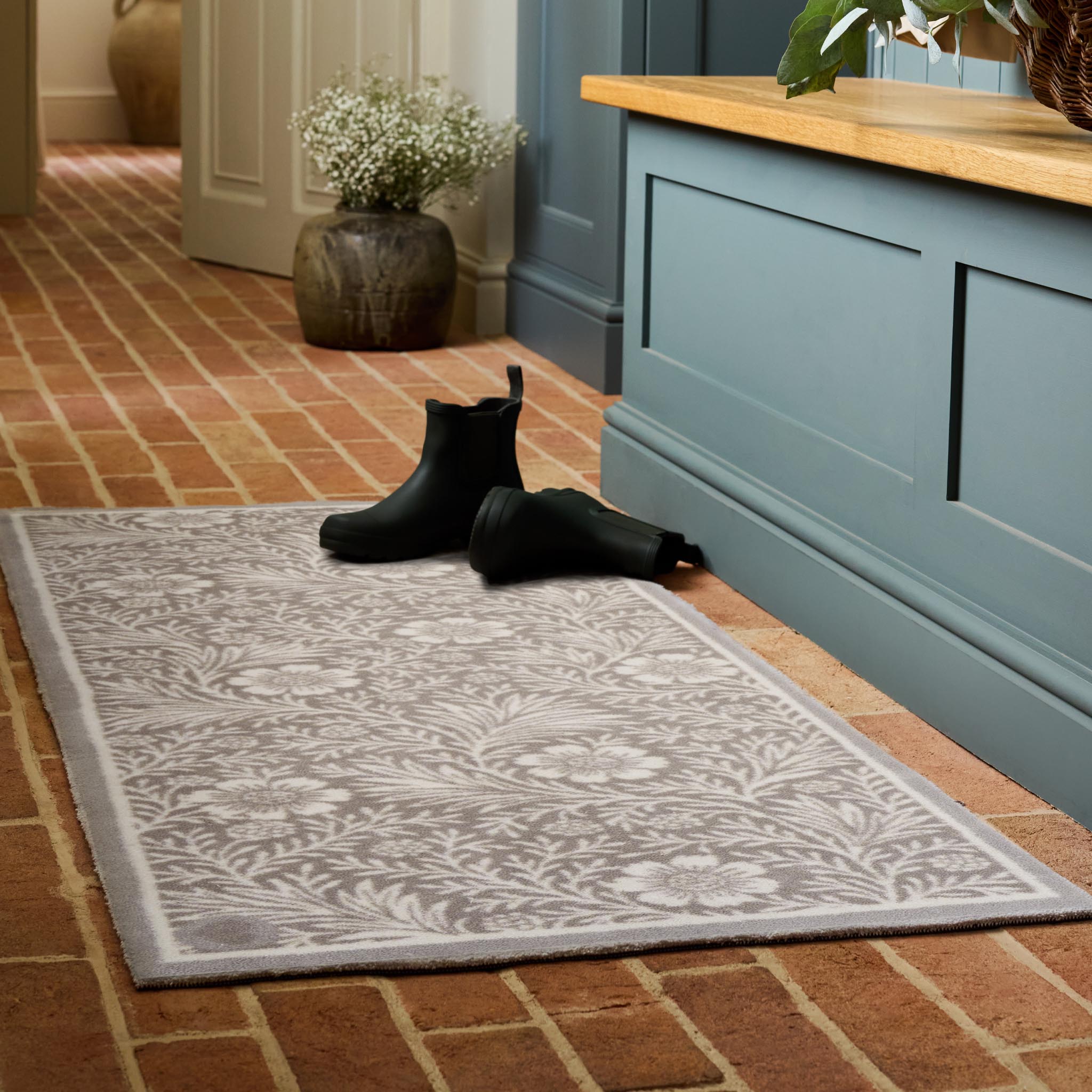 Soft Floral Washable Doormat- a cotton doormat featuring an elegant white floral pattern.