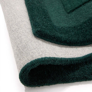 Stacked Borders Evening Blue Rug- a 100% two toned wool rug in dark green.