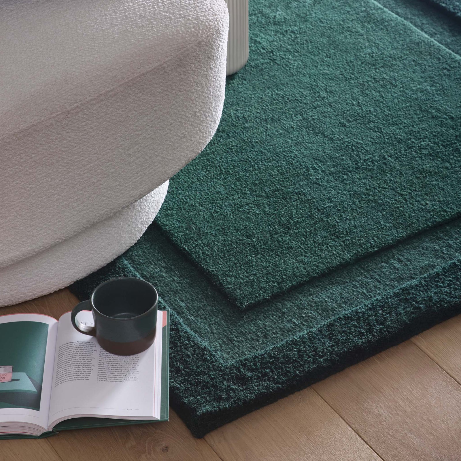 Stacked Borders Evening Blue Rug- a 100% two toned wool rug in dark green.