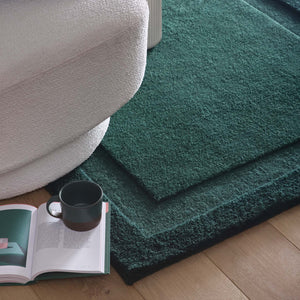 Stacked Borders Evening Blue Rug- a 100% two toned wool rug in dark green.