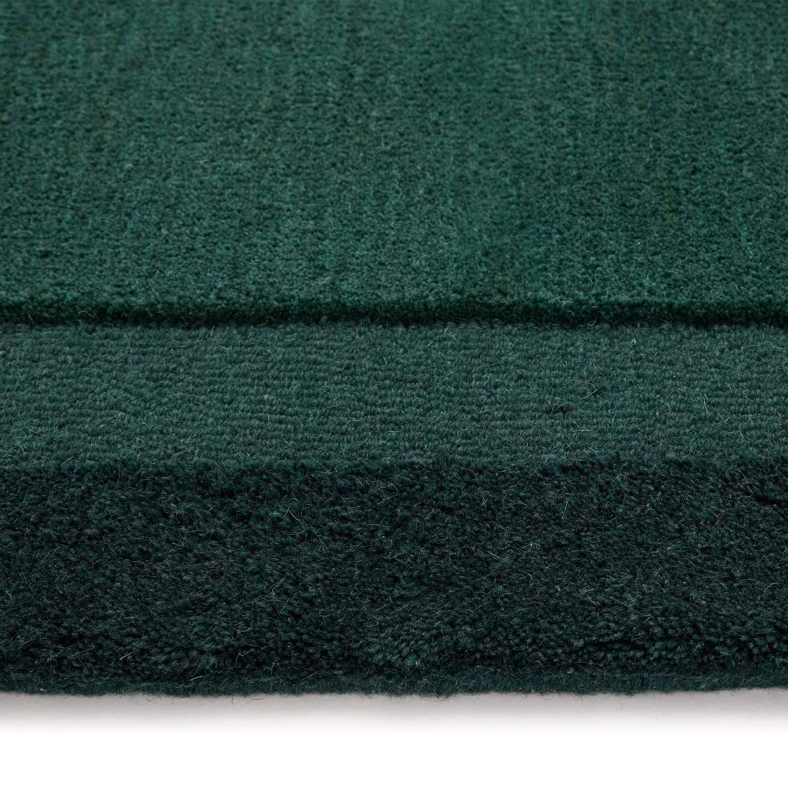 Stacked Borders Evening Blue Rug- a 100% two toned wool rug in dark green.